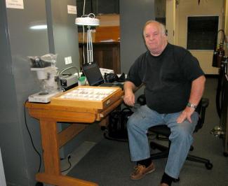 Cecil Smith, Associate Curator and Collections Manager for the UGCA, sitting in the Arthropods collection room in 2009.